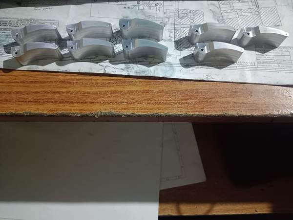 Machined component set laid out for inspection